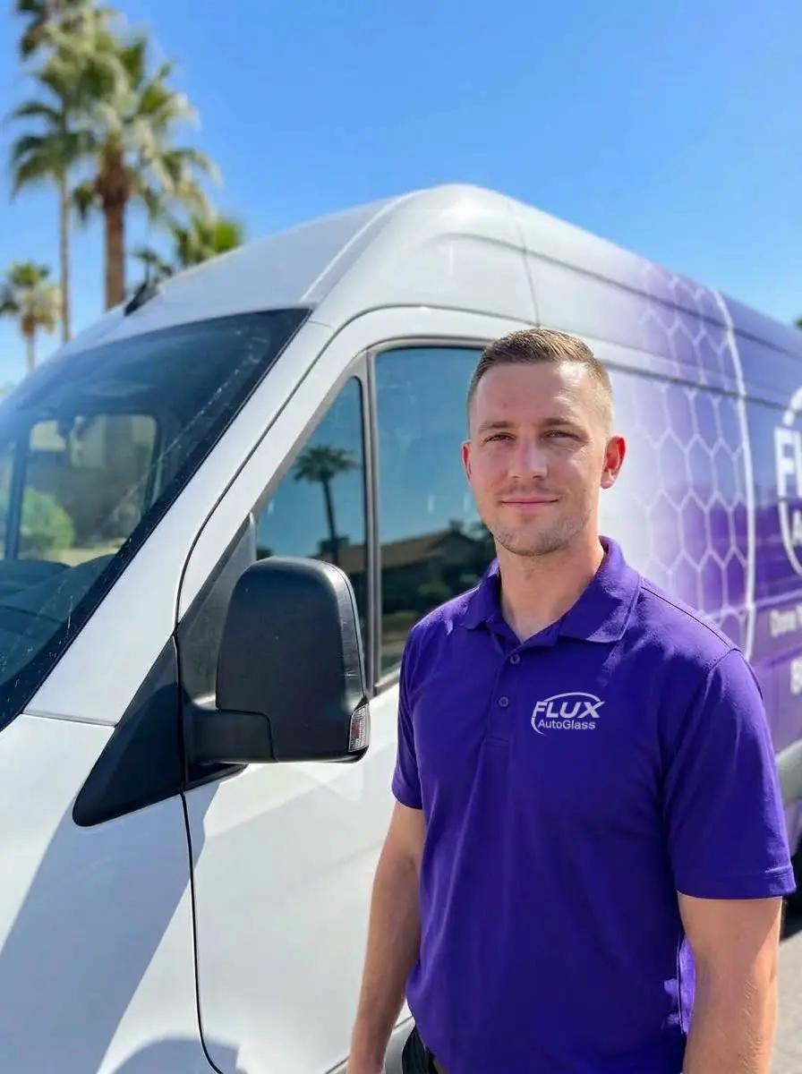 Flux Auto Glass technician in front of a mobile service van in Phoenix, Arizona